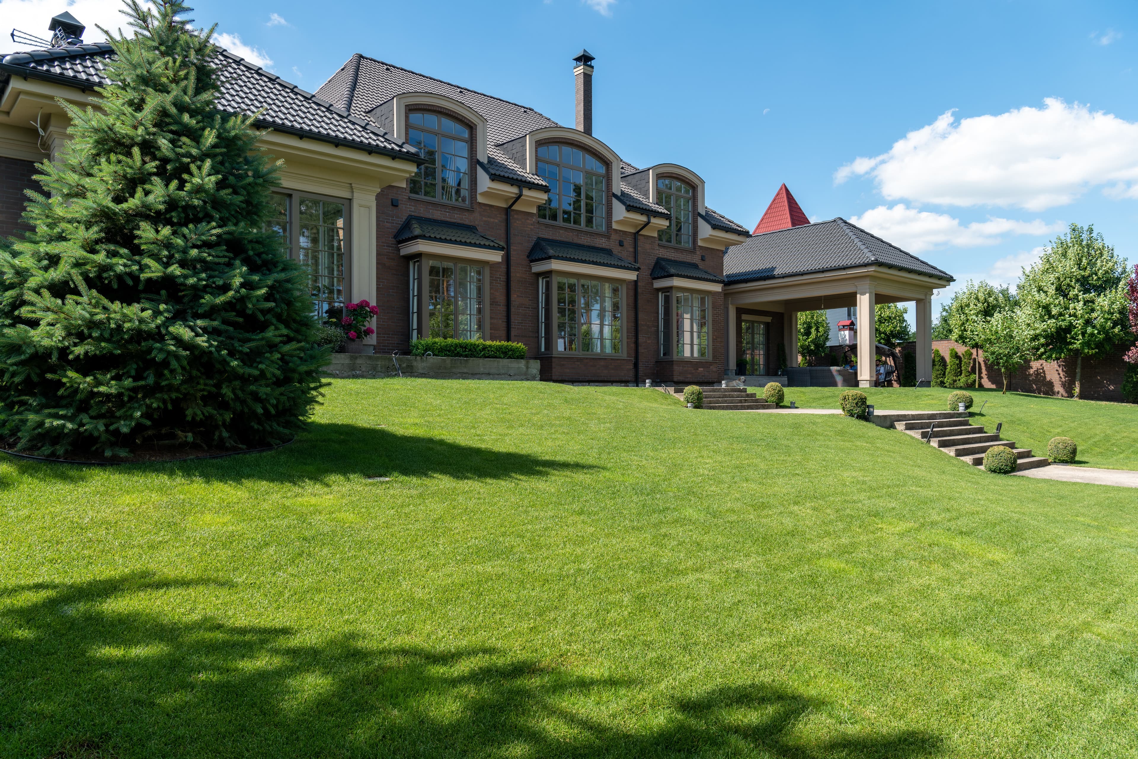 Clean modern home exterior with maintained landscaping